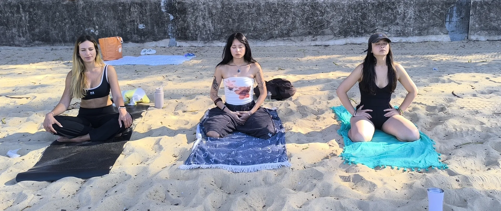 Women preparing for yoga class in welcoming studio space