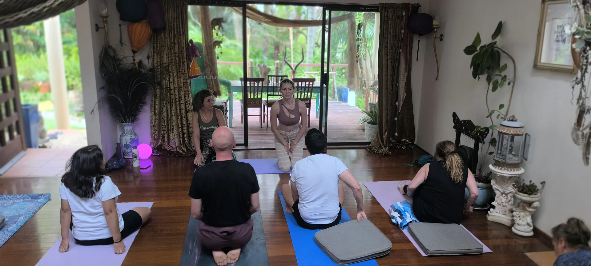Women enjoying yoga practice in supportive group environment